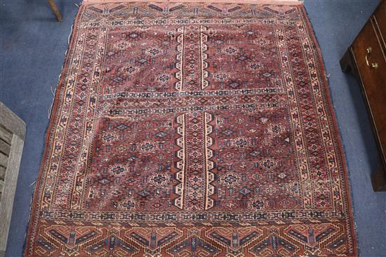 A Bokhara rug with traditional all-over panelled design, 150cm x 145cm
